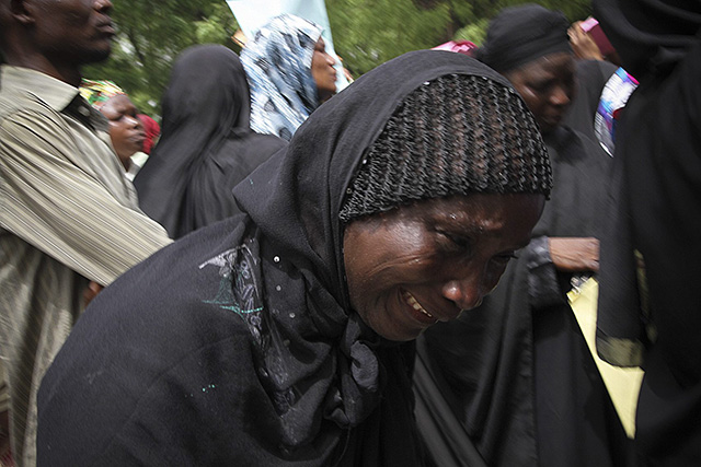 Parents and relatives of kidnapped schoolgirls react during a protest over the Nigerian government's failure to rescue the abducted girls. (Photo: EPA/STR/Newscom)